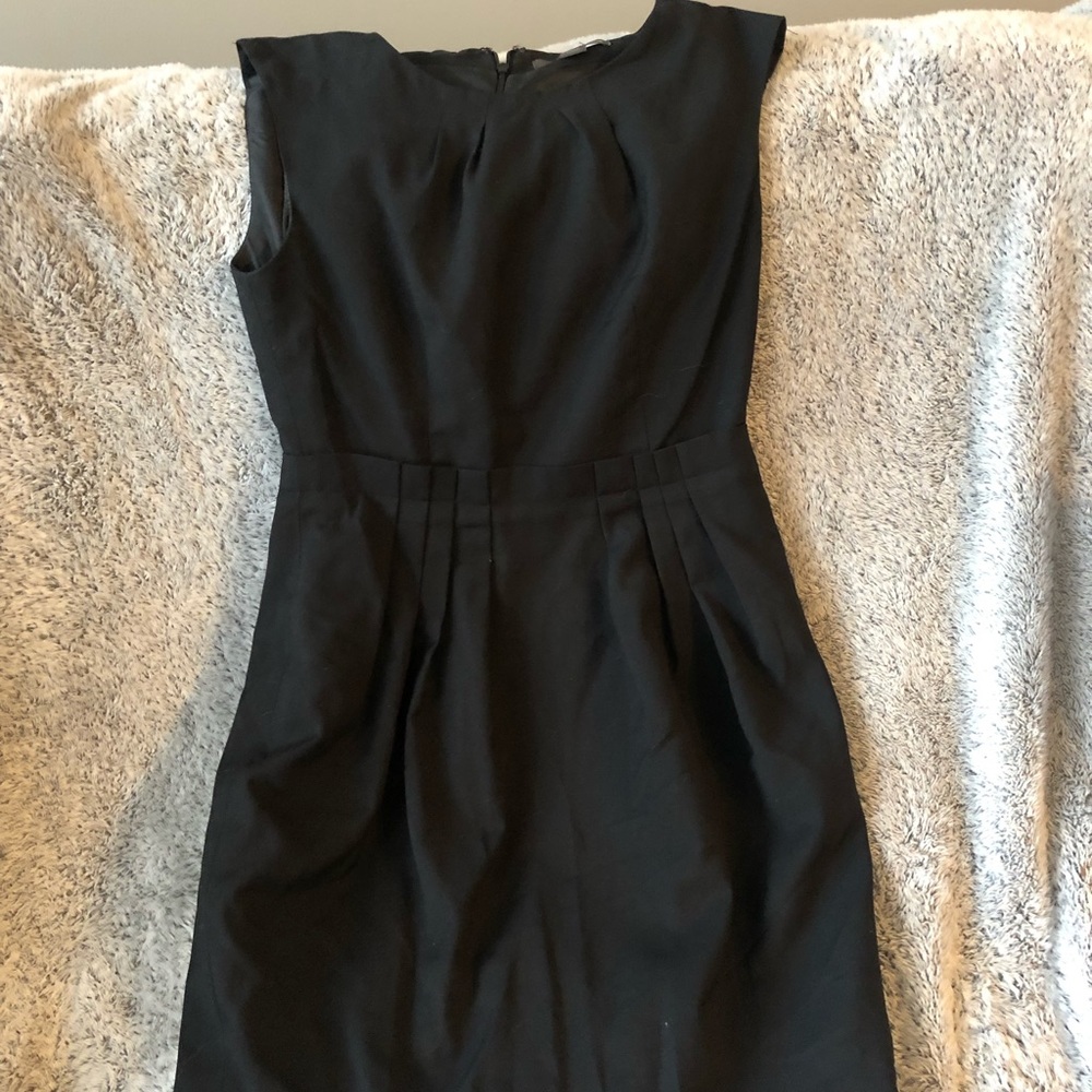 Black sleeveless dress with paper bag waist